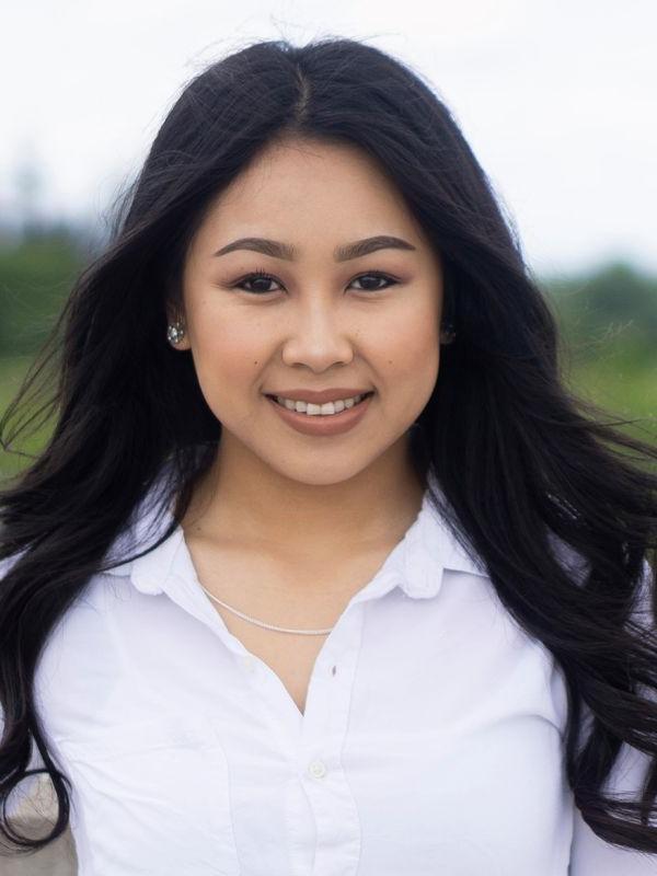 A portrait of a woman in a white shirt 