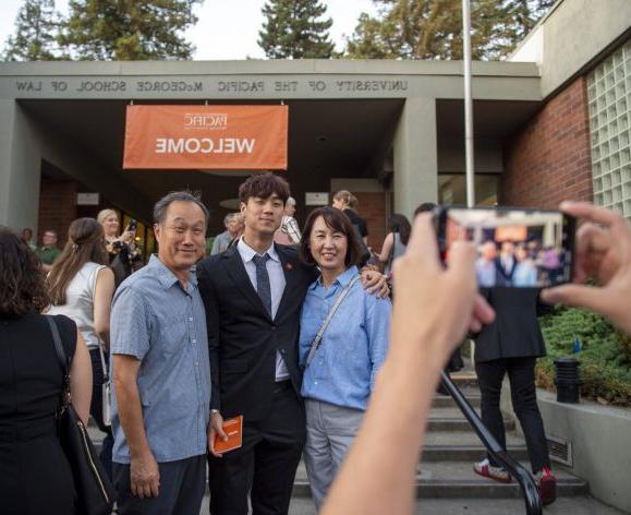 families taking pictures following commencement